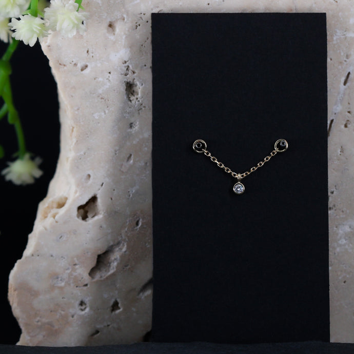 genuine diamond bezel set stone charm on a solid gold chain