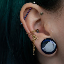 Load image into Gallery viewer, Solid yellow gold chain wrapped around a conch piercing
