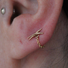 Load image into Gallery viewer, Solid yellow gold diamond cut cable chain wrapped around an ear lobe piercing
