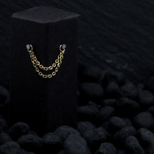 Load image into Gallery viewer, Solid yellow gold diamond cut chain draped across black display
