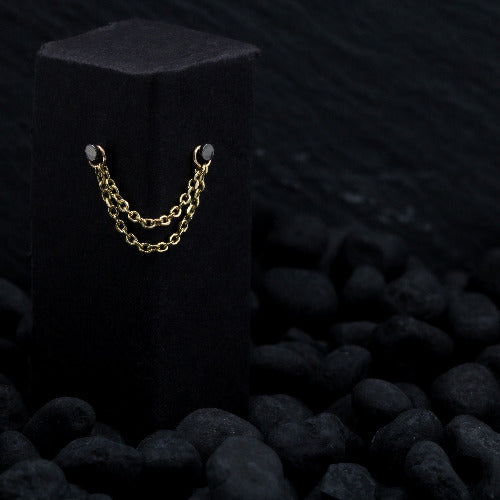 Solid yellow gold diamond cut chain draped across black display